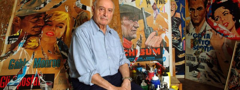the painter mimmo rotella in his studio is seated on a news photo 1643628451 scaled e1704211727957 772d0682 - Home - 10 Ricordando Mimmo Rotella, a Catanzaro la mostra ‘Autorotella’